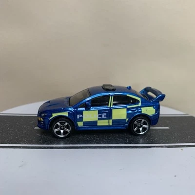2016 Matchbox 2015 Subaru WRX STI Police Sedan Blue & Fluorescent Yellow 1:64 NM - Image 1 of 4