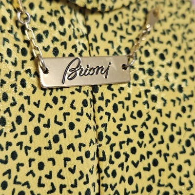 Corbata Brioni lunares negros con patrón amarillo 100 % seda auténtica Italia en muy buen estado  Foto 1 de 4
