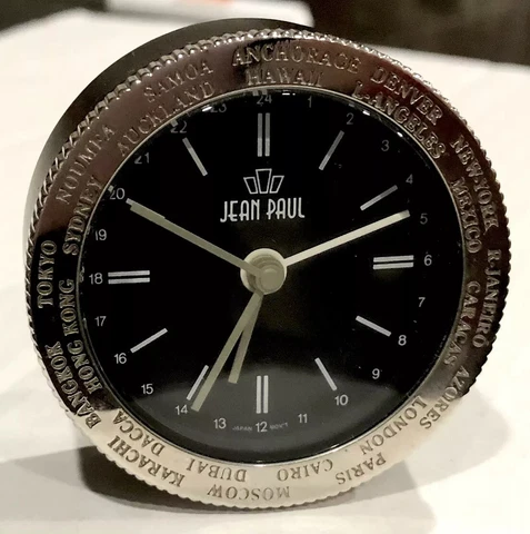 Vintage Travel Alarm Clock with World Time Zones & Adjustable Dial by Jean Paul Cover