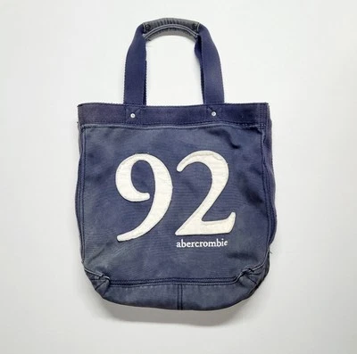 Bolso de Mano Abercrombie & Fitch Azul Denim Envejecido Bordado con Bolsillo Trasero Foto 1 de 4