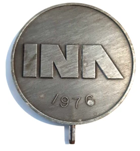 Pieza de metal INA 1976 Envíanos tu fuego - Imagen 1 de 3