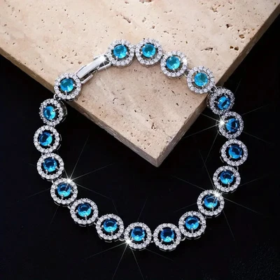 Brazalete para mujer tenis topacio azul creado en laboratorio redondo de 15 quilates enchapado en oro blanco de 14 quilates Foto 1 de 4