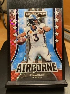 2023 Panini Rookies & Stars - Airborne Russell Wilson #AI-10 Red Plaid Prizm - Bild 1 von 3