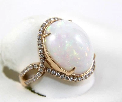 Anillo infinito solitario ovalado con halo de diamantes y ópalo de fuego de oro rosa de 14 k de 10,05 quilates Foto 1 de 4