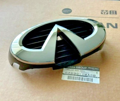 New OEM Infiniti M35H M37 M56 !CHECK YEAR! Front Grille Emblem 62890-1MA0B - Image 1 of 4