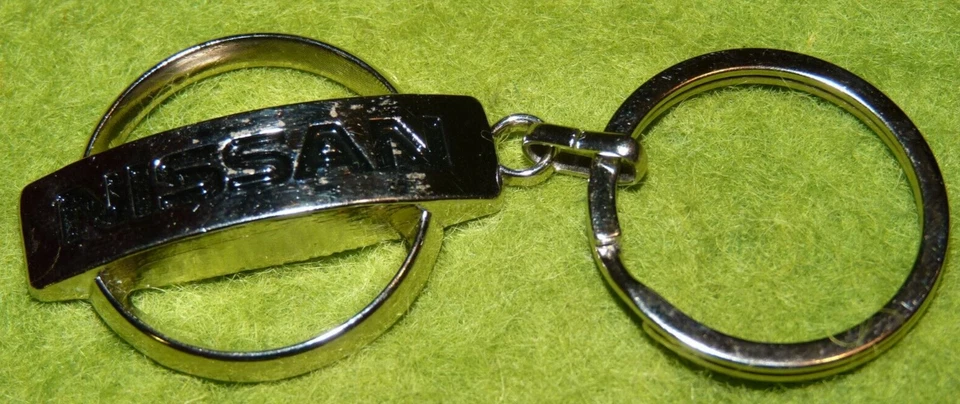 Porte clés en acier logo Nissan Bastyauto.com Pithiviers  Keyring  Portachiavi - Photo 1/1