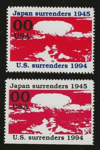 JAPAN SURRENDERS - 2 ATOMIC BOMB POSTER STAMPS - BLUE & BLACK PRINT VARIETIES - Picture 1 of 1