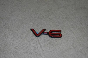 SATURN L100 L200 L300 LW100 LW200 LW300 V6 EMBLEM LOGO BADGE NEW  OEM (2005) - Picture 1 of 3