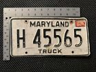Plaque d'immatriculation de camion vintage Maryland étiquette blanche avec lettrage noir Exp 86
