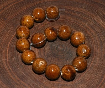 Cadena de 15 cuentas de cerámica de miel oscura Foto 1 de 4