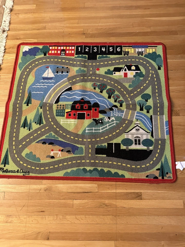 MELISSA & DOUG “ROUND THE TOWN ROAD “ALFOMBRA 39” X 36” PARA LOS MÁS PEQUEÑOS Foto 1 de 4