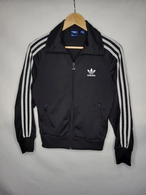 Chaqueta de pista Adidas Firebird con cremallera para mujer talla pequeña negra blanca tres rayas Foto 1 de 4