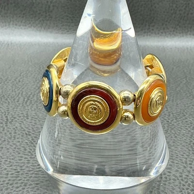 Brazalete elástico Liz Claiborne logotipo escudo tono dorado esmalte multicolor Foto 1 de 4