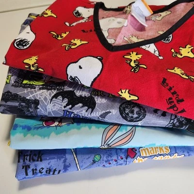 Scrub Top Bundle (4) Lot L/XL Disney Looney Tunes Peanuts Halloween Vtg Children - Image 1 of 4