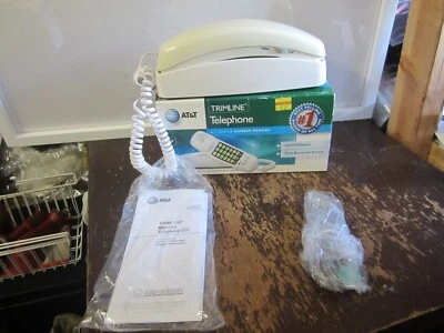 Teléfono AT&T Trimline 210 con memoria de 13 números y teclado iluminado marfil con caja Foto 1 de 4