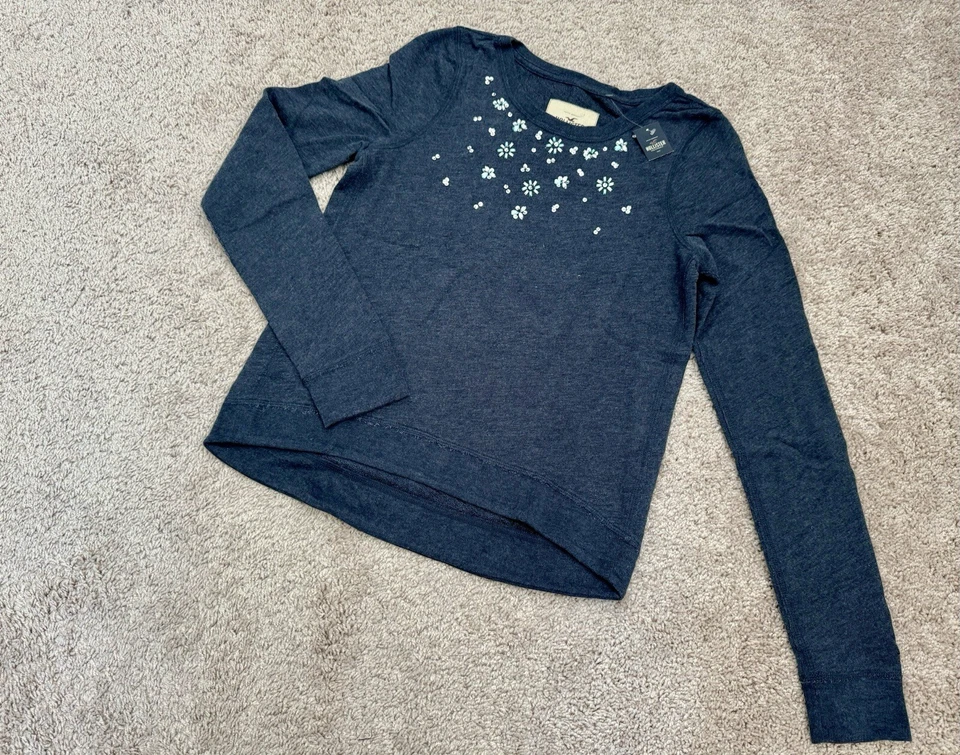 NUEVO CON ETIQUETAS Hollister Lentejuelas Escote con Cuentas Para Mujer Pullover Sudadera Azul Marino Talla S Foto 1 de 4
