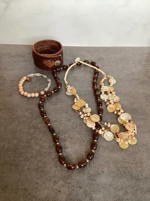 Brown bead and shell necklaces leather and bead bracelets Lot of 4 - Image 1 of 4