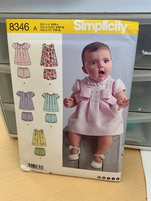 uncut Simplicity 8346 Baby Dresses in 5 Styles & Panties Pattern XXS-L - Image 1 of 2