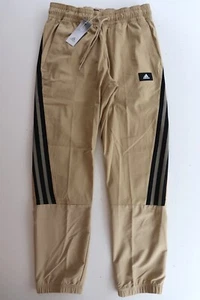ADIDAS SPORTSWEAR FUTURE ICONOS TEJIDO RIPSTOP PANTALONES BEIGE HA6568 HOMBRE M - Imagen 1 de 15