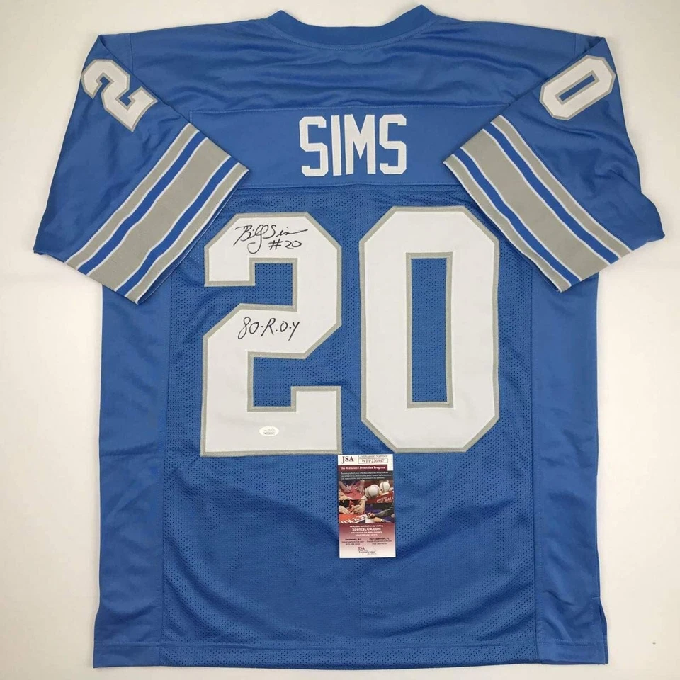 Camiseta de fútbol americano azul de Detroit autografiada/firmada de Billy Sims 80 ROY certificado de autenticidad JSA Foto 1 de 4