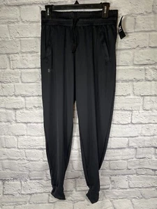 NEW Under Amour Pants Womens Small Activewear Loose Fit Heat Gear Black Joggers - Picture 1 of 8