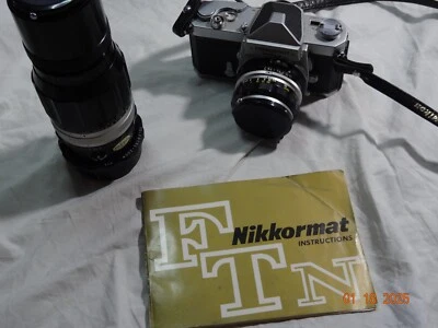 Nikkormat 35mm SLR Film Camera With  50mm Nikkor-H 50mm F2  and 200 mm lens - Image 1 of 4