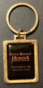 Llavero publicitario negro dorado para concesionario Honda Stillwater Oklahoma - Imagen 1 de 2