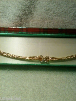 Brazalete X de cristal transparente enchapado en oro amarillo para dama 7 1/4 de largo nuevo $29 Foto 1 de 3