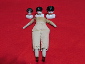 Antique Cloth & Porcelain 7" Doll Body With 3 China Doll Heads. Good Cond.