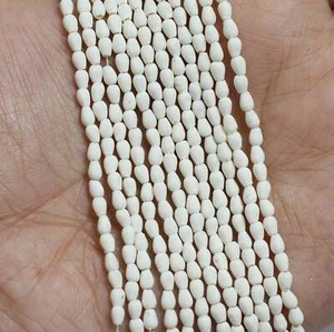 12 corde, perline a goccia acriliche bianche 4x3 mm - Foto 1 di 8