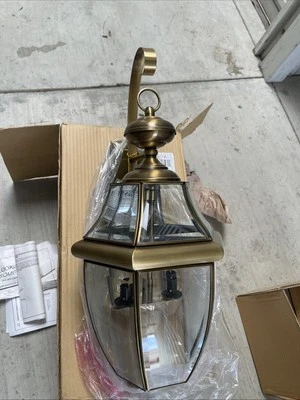 Quoizel NY8317A Outdoor Lantern, 3x60W Candelabra Sockets, Antique Brass Finish - Imagem 1 de 4