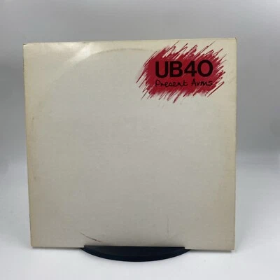 UB40, Present Arms, Vinyl Album + 12" Single VG/VG+ Foto 1 de 4