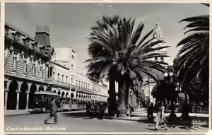 COCHABAMBA, BOLIVIA ~ TROLLEYS ON MAIN ROAD, REAL PHOTO POST CARD ~ c. 1940s-50s - Picture 1 of 2