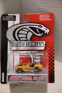 Shelby Collectibles Yellow Shelby Cobra 427 S/C 1:64 Scale Diecast Blue Stripe - Picture 1 of 1