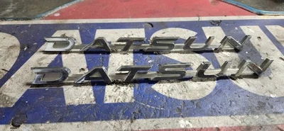 Datsun 68- 73 510 Pair OEM Front Fender Emblems (2x) - Image 1 of 2