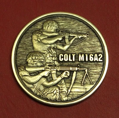 Colt Firearms M16A2 Display Case Bronze Medallion - Image 1 of 2