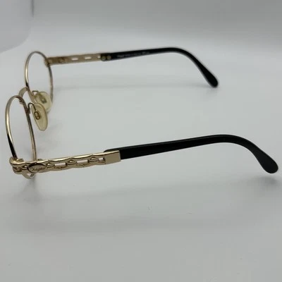 Gafas de sol vintage doradas de metal negro con monturas ovaladas Italia 54-17-135 Chagall Tura Foto 1 de 4