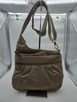 Bandolera Travelon antirrobo firma dorada Foto 1 de 4