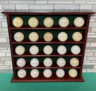 25 pelotas de golf autógrafas vintage surtidas con estante de exhibición Foto 1 de 4