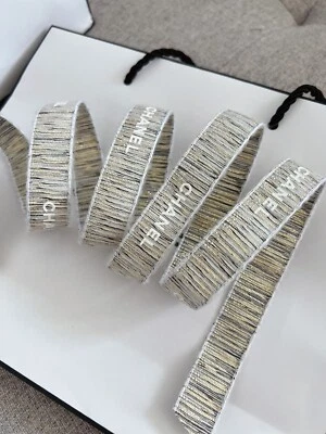 CHANEL Gold with white embossed lettering Ribbon Sold By Yard 100% Authentic - Image 1 of 3