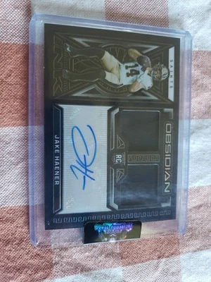 2023 Panini Obsidian Jake Haener RC Auto Dual RPA  /199 #RJI-JHA Saints SP - Image 1 of 4