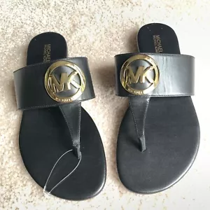 NEW Michael Kors Womens 7.5 Racquel Sandal Thong Black Leather Gold MK Medallion - Picture 1 of 11