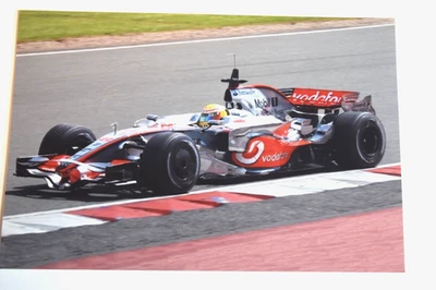 Lewis Hamilton AUTOGRAPHED Hand Signed 5 x 7 1/2" Photo Driving a McLaren F1 Car - Image 1 of 2