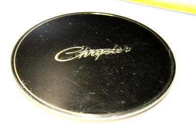 Tapacubos Chrysler emblema New Yorker OEM Foto 1 de 3