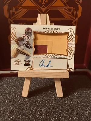 Amon-Ra St. Brown 2021 Leaf Trinity XRC Rookie Patch Auto RC Bronze Lions - Image 1 of 2