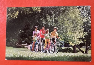 1968 Vintage Unused USA Advertising Postcard ~ FAMILY RIDING BICYCLES - Picture 1 of 2