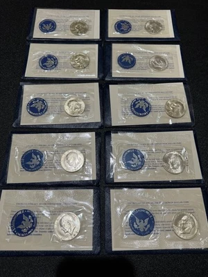 (10)  1973  US EISENHOWER BLUE ENVELOPES,  40% SILVER DOLLARS, in ALL OGP!!! - Image 1 of 4