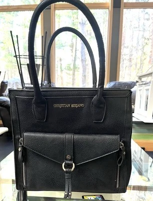 Bolso de mano Christian Siriano negro, moda con hebillas doradas y bolsillo con cremallera. Foto 1 de 4