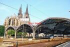 PHOTO  CONTRAST IN ARCHITECTURE: KOLN RAILWAY STATION WITH THE CATHEDRAL NEXT DO
