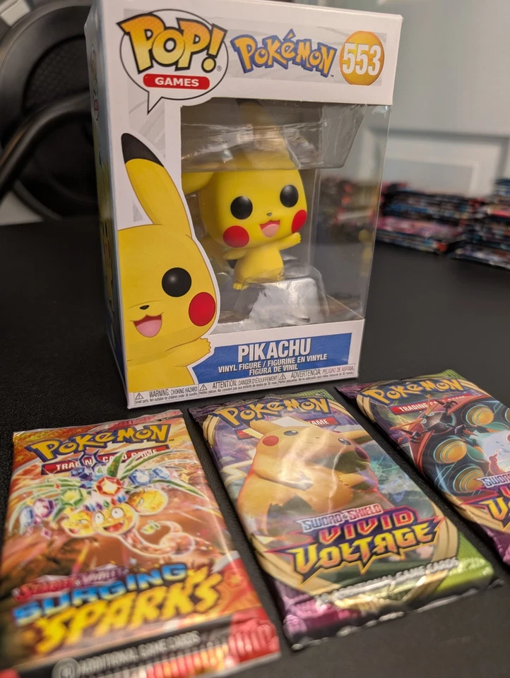 Pokemon Surging Sparks Booster Pack + 2 Vivid Voltage + Funko Pop Pikachu #553 - Image 1 of 1